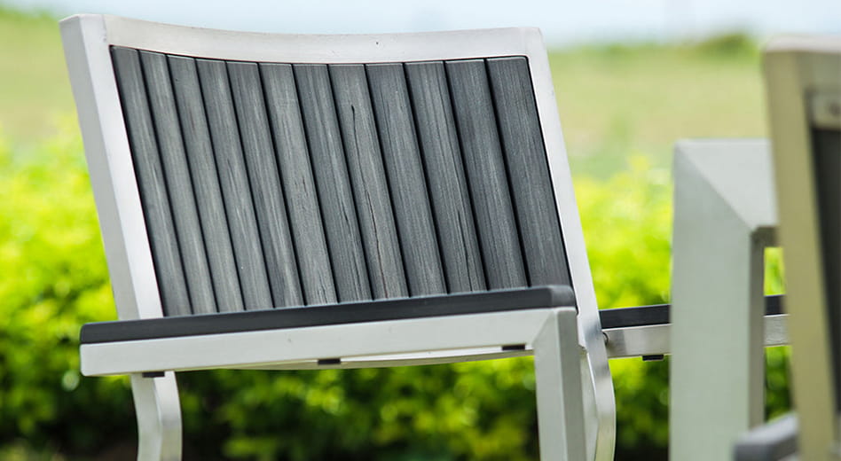 close up of MityLite's Willow faux wood-grain seat texture