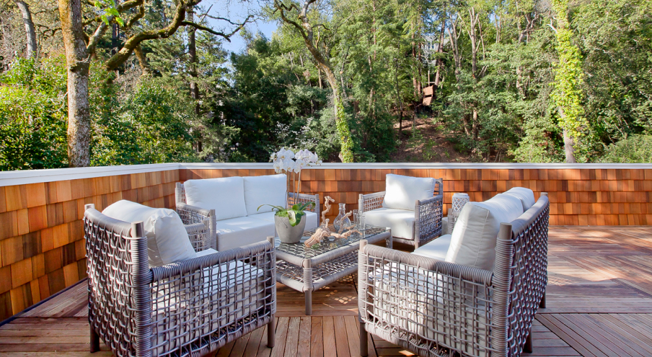 Luxurious faux-wicker outdoor furniture on patio in southwestern pine forest