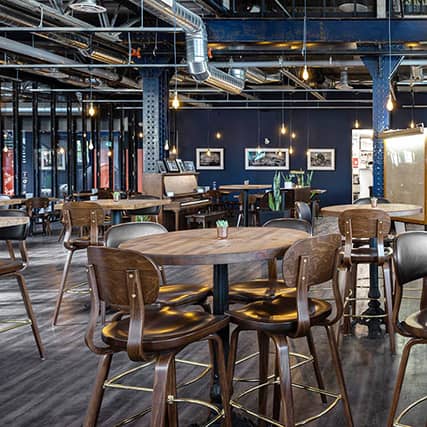 Kristi barstool in a modern, industrial bar and restaurant setting