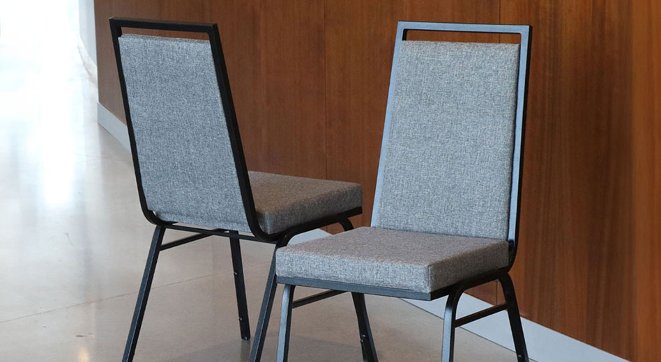 Two Access Banquet Chairs sitting side-by-side showcasing the front and back