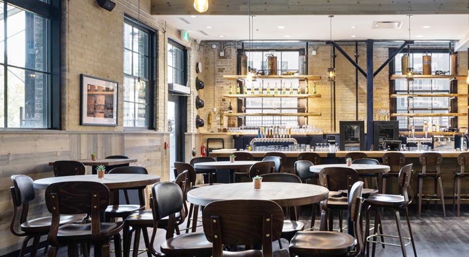 Modern wooden dining chairs in industrial gastro-pub