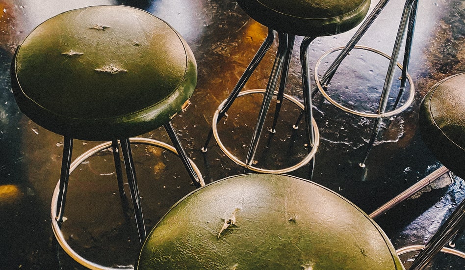 Barstools with cracked vinyl cushions